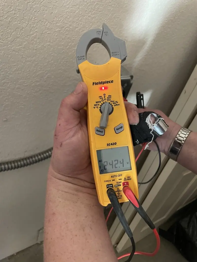 Voltage testing with clamp meter during Electrical Installation Services in Lake